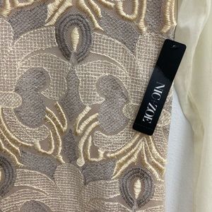 This is a champagne colored blouse by Nic+Zoe. brand new condition with tag.